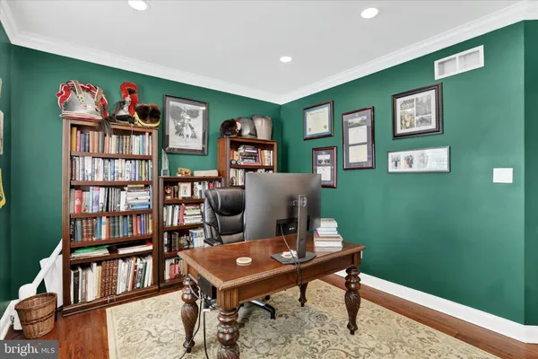 a kitchen with stainless steel appliances granite countertop a sink a stove and a wooden cabinets