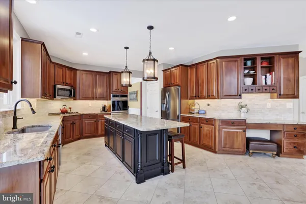 a aerial view of a house with a yard patio and fire pit