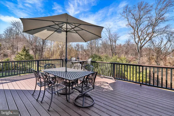 a bedroom with a bed and a night stand