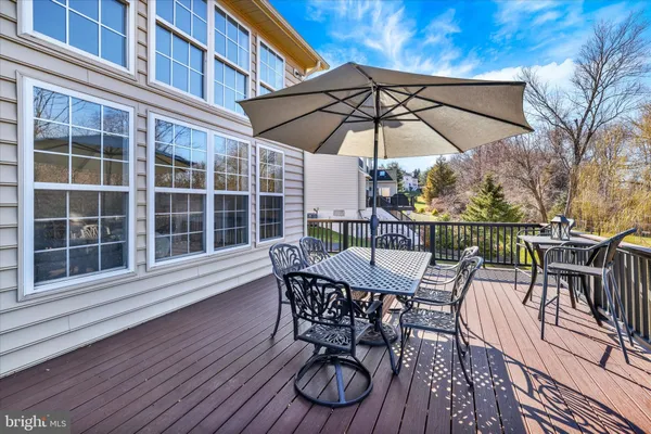 a bedroom with a bed and a chair