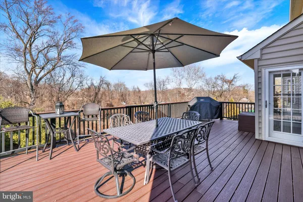 a living room with furniture wooden floor and a fireplace