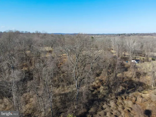 a white bath tub sitting next to a white sink