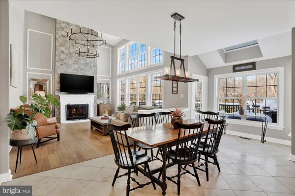 a bedroom with a bed a dresser and a window