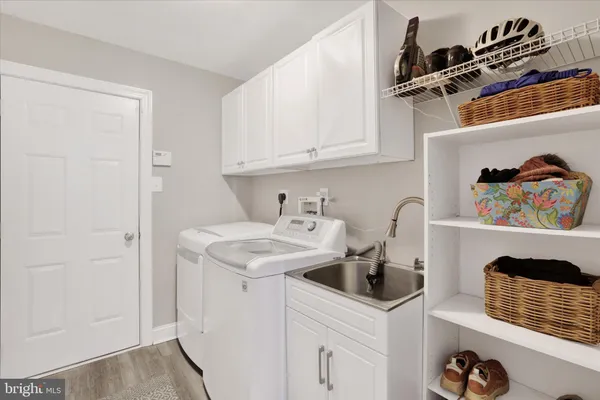 a living room with fireplace furniture and a wooden floor