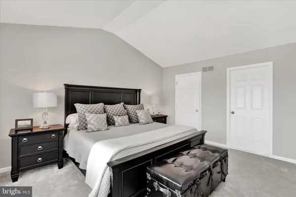 a bathroom with a toilet a sink and a mirror