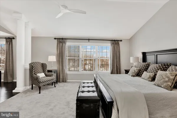 a view of a patio with couple of chairs and a table