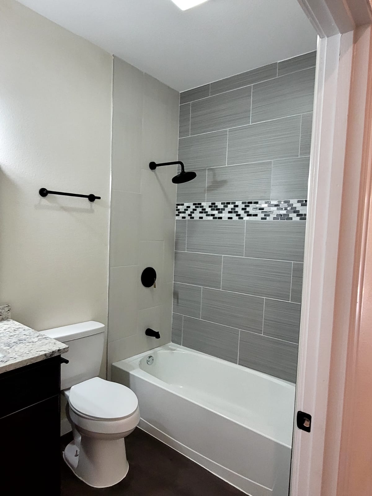 750 South Main Street Lockhart, TX 78644 - Photo 11 of 31 a bathroom with a bathtub shower sink vanity and toilet