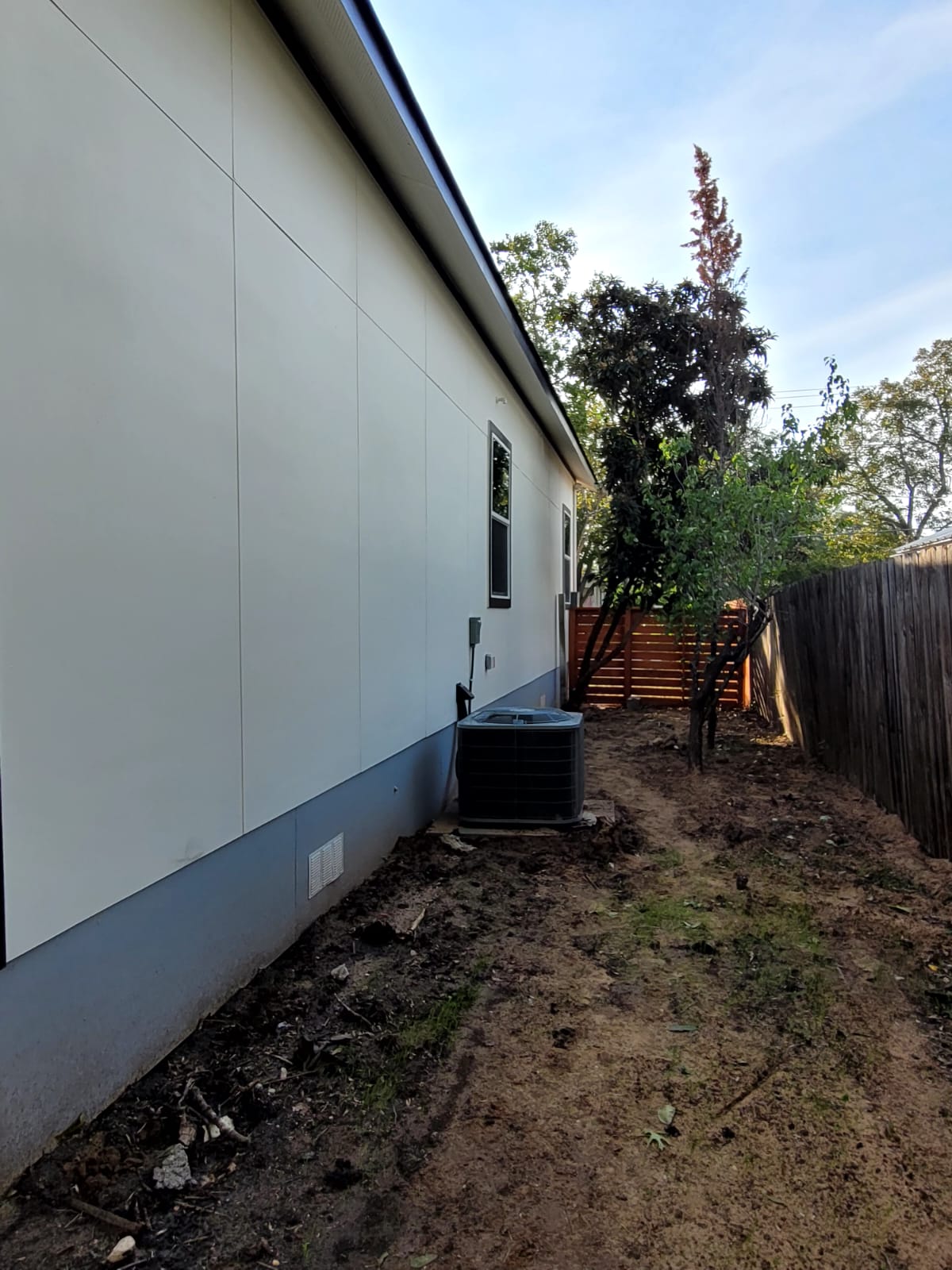 750 South Main Street Lockhart, TX 78644 - Photo 28 of 31 a backyard of a house with table and chairs