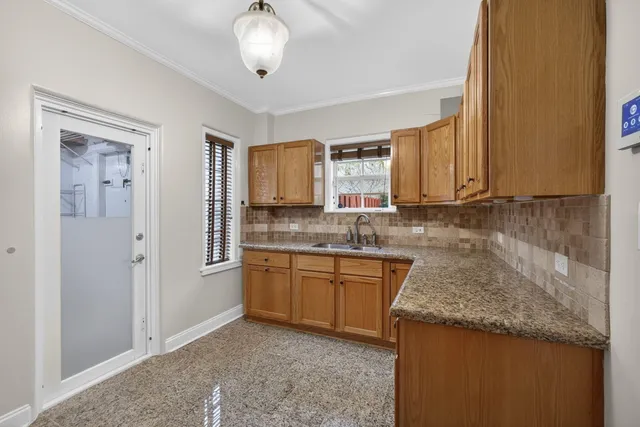a utility room with a sink dryer and washer