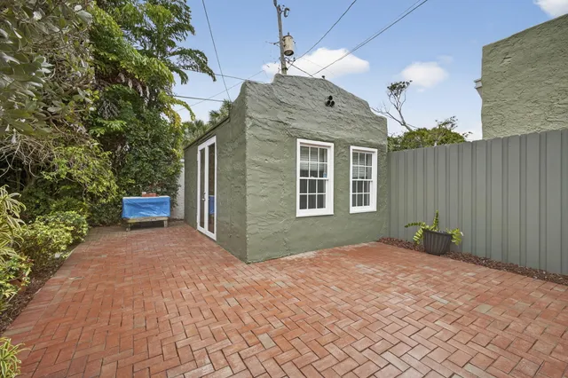 a white toilet sitting next to a bathroom sink