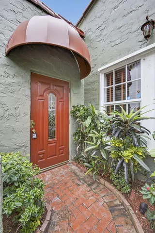 a view of a livingroom with wooden floor and staircase