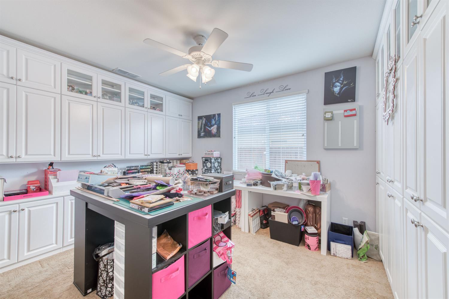 677 Everglade Avenue Clovis, CA 93619 - Photo 18 of 29 a table that has a lot of cabinets