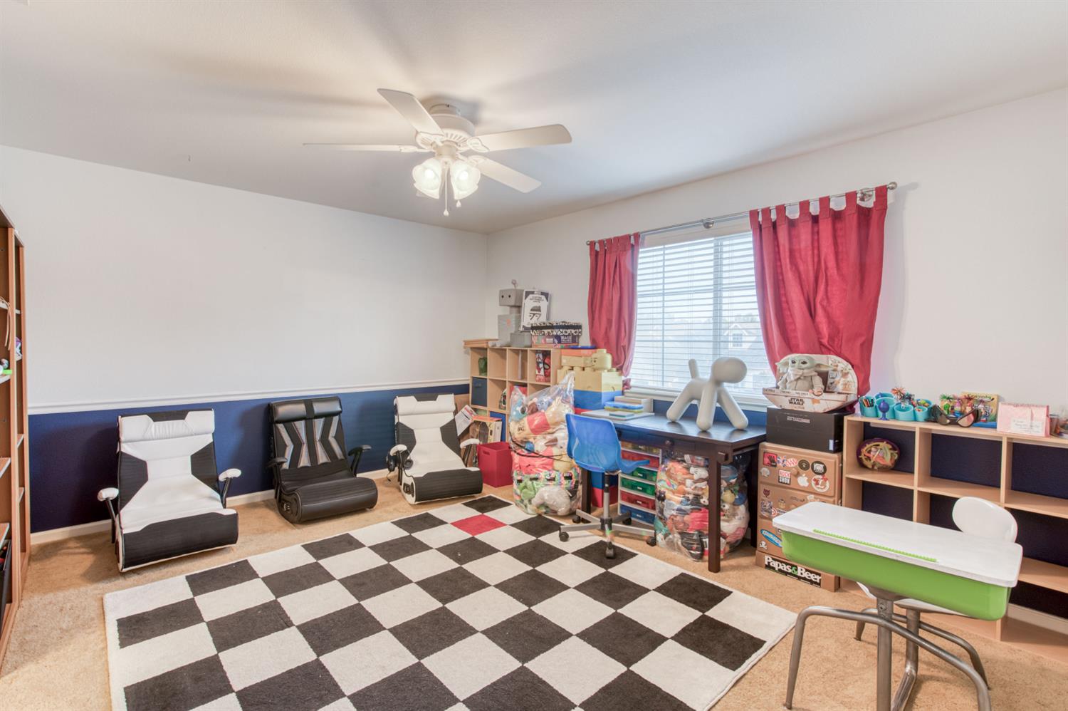 677 Everglade Avenue Clovis, CA 93619 - Photo 21 of 29 a living room with a black white checkered floor with couches chair and a coffee table