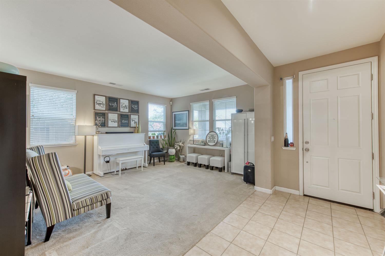 677 Everglade Avenue Clovis, CA 93619 - Photo 7 of 29 a living room with furniture and a couch