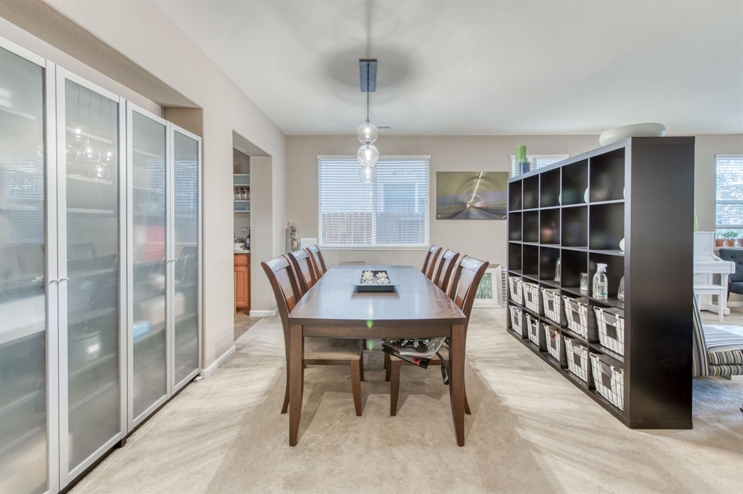 677 Everglade Avenue Clovis, CA 93619 - Photo 10 of 29 a view of a dining room with furniture window and wooden floor