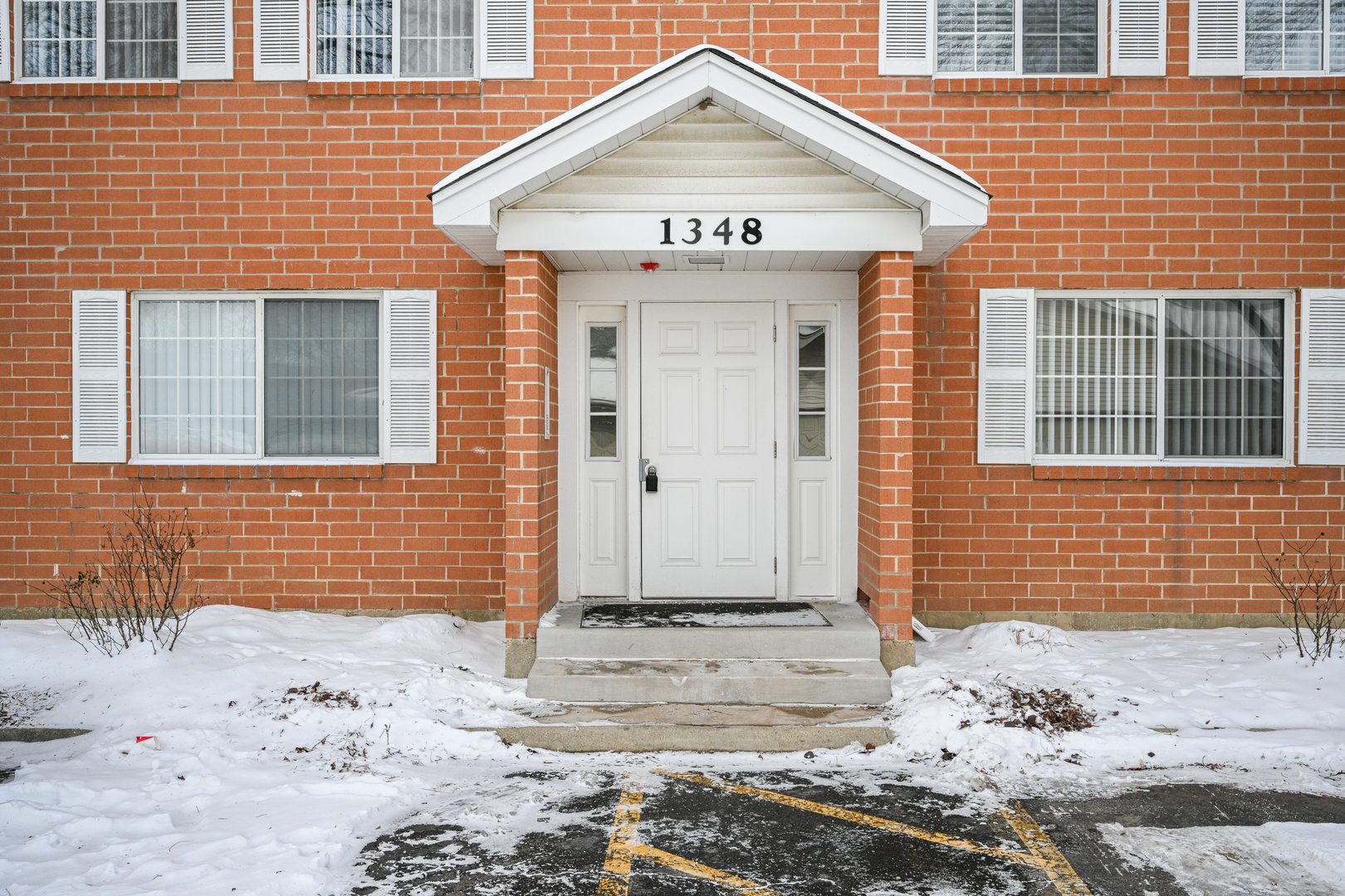 1348 South Lorraine Road, Unit A Wheaton, IL 60189 - Photo 1 of 21 a front view of a house