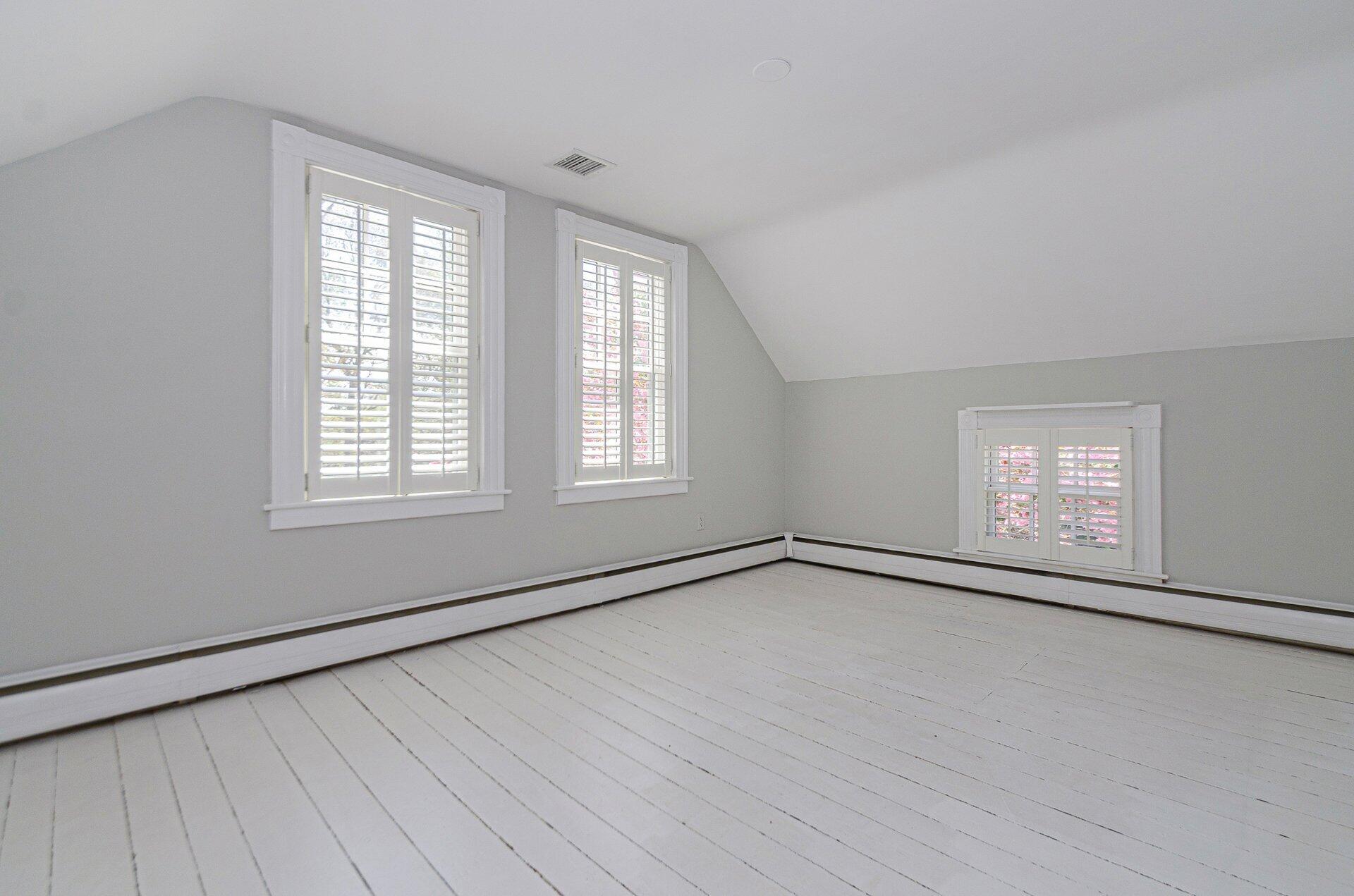 1089 Main Street Cotuit, MA 02635 - Photo 21 of 41 a view of an empty room with wooden floor and a window