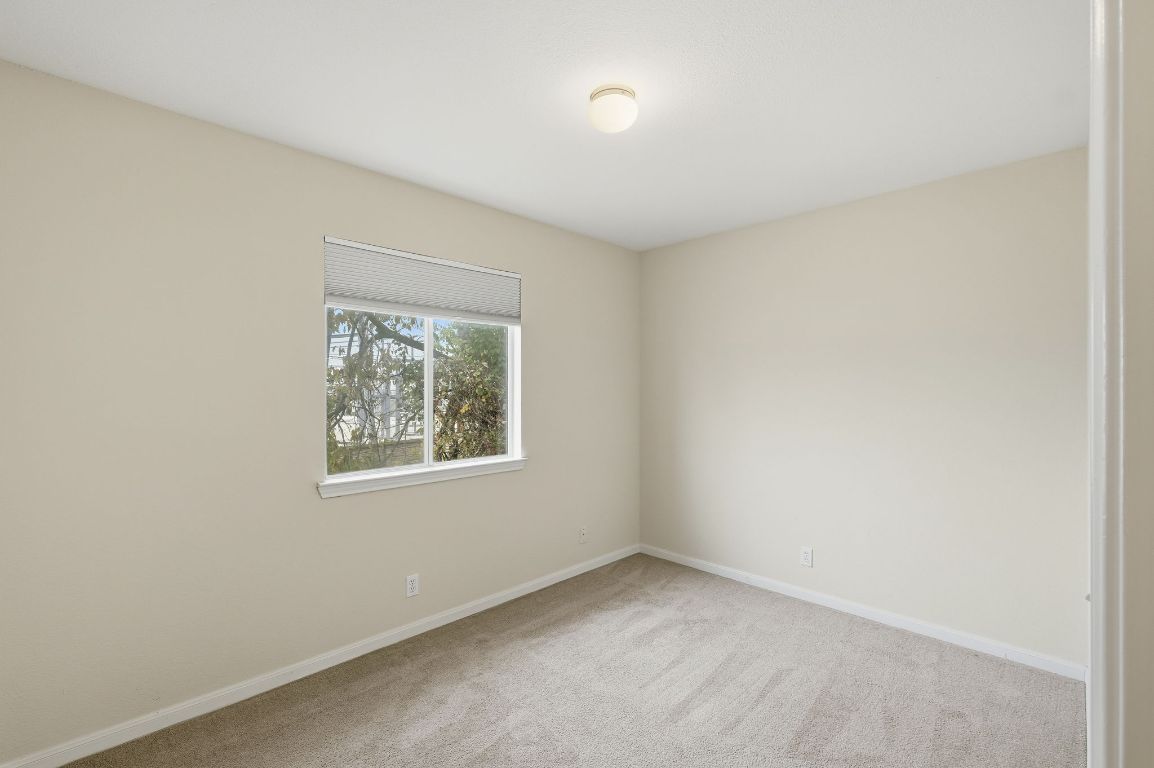 3201 E El Salido Parkway, Unit 422 Cedar Park, TX 78613 - Photo 12 of 15 Unfurnished room featuring light carpet and baseboards