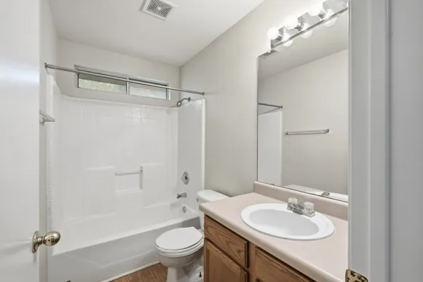 a bathroom with a sink toilet tub and shower