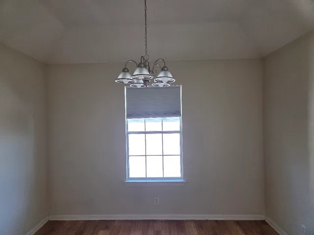 a view of a windows and chandelier in a room