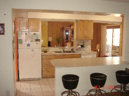 160 North Pinecrest Road Bolingbrook, IL 60440 - Photo 7 of 12 a kitchen with a table and chairs