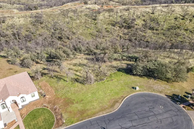 a view of a swimming pool with a yard