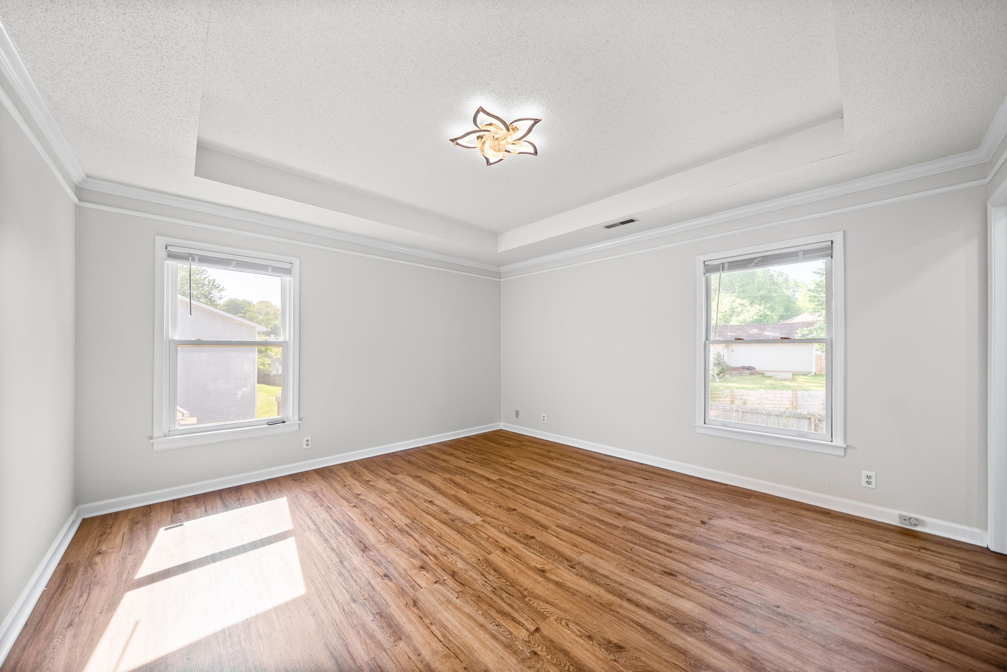 1706 Hazelwood Road Clarksville, TN 37042 - Photo 15 of 31 wooden floor in an empty room with a window