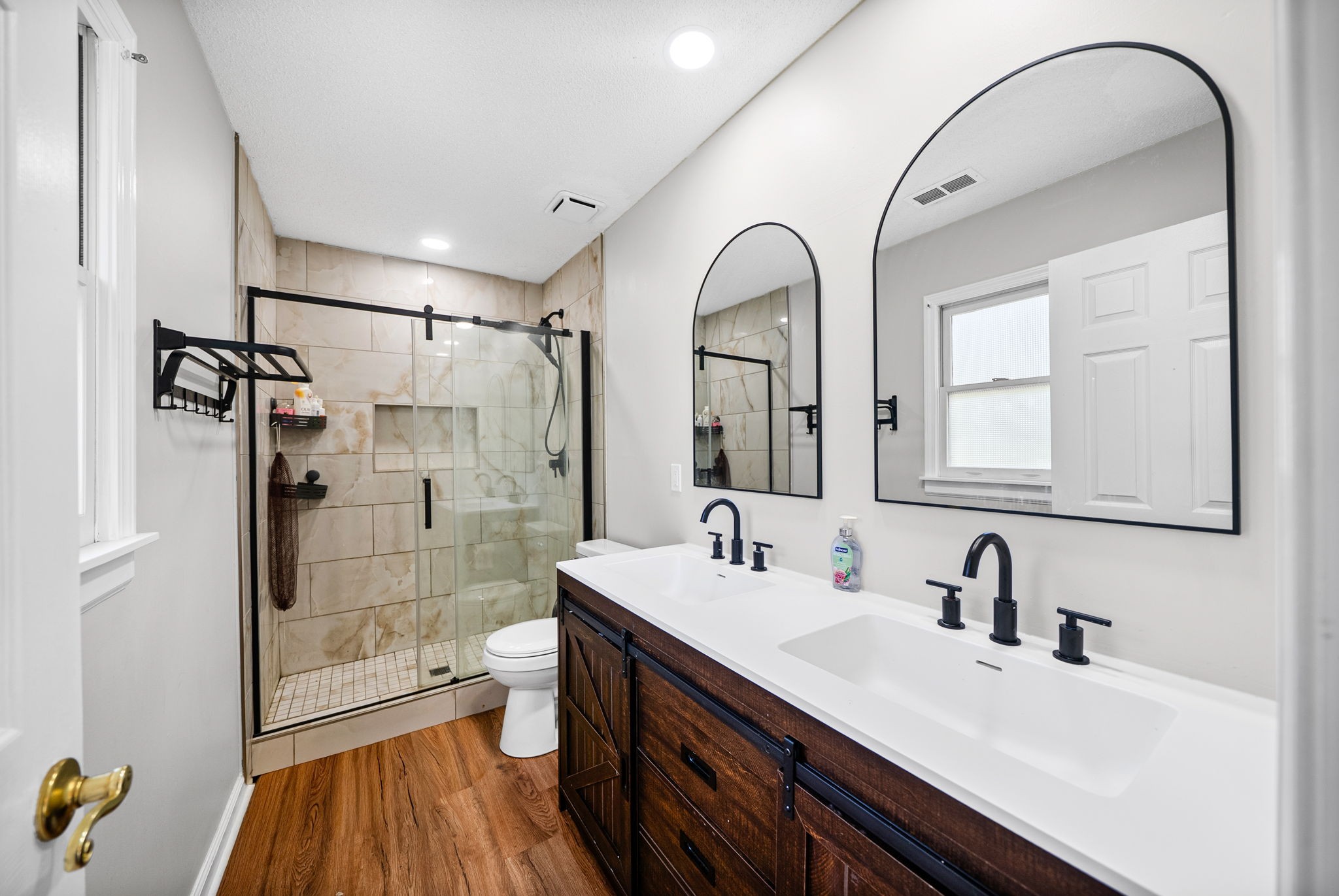 1706 Hazelwood Road Clarksville, TN 37042 - Photo 17 of 31 a bathroom with a double vanity sink toilet and shower