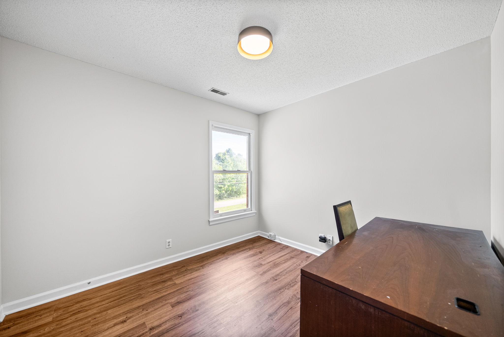 1706 Hazelwood Road Clarksville, TN 37042 - Photo 19 of 31 a view of a room with wooden floor and window