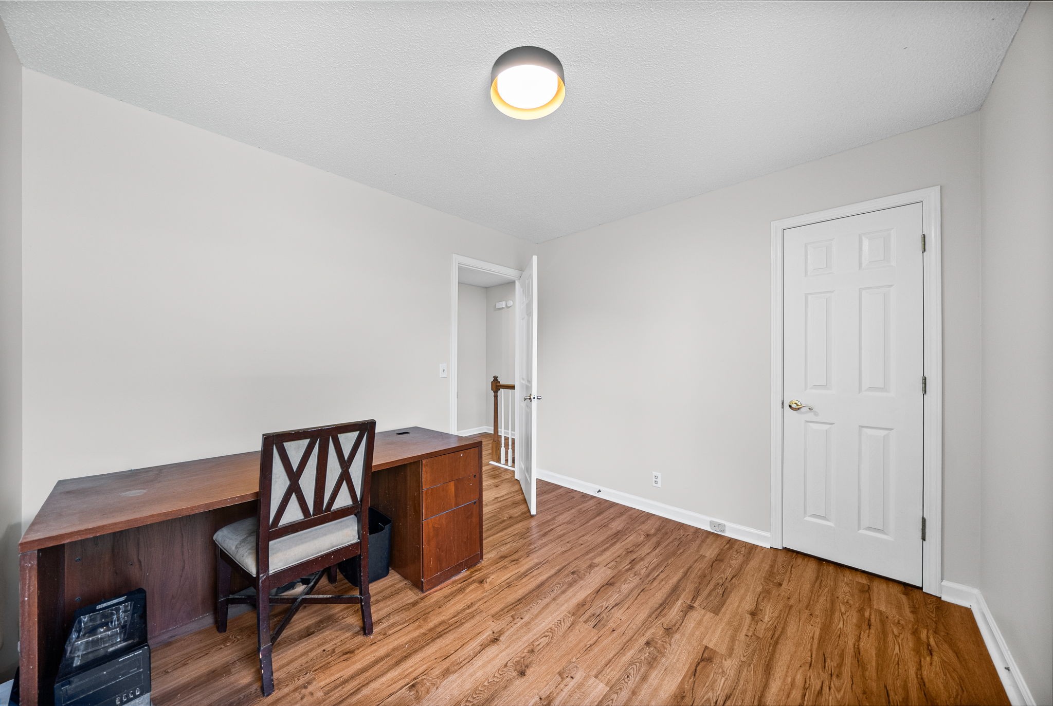 1706 Hazelwood Road Clarksville, TN 37042 - Photo 20 of 31 a view of a room with wooden floor and chair