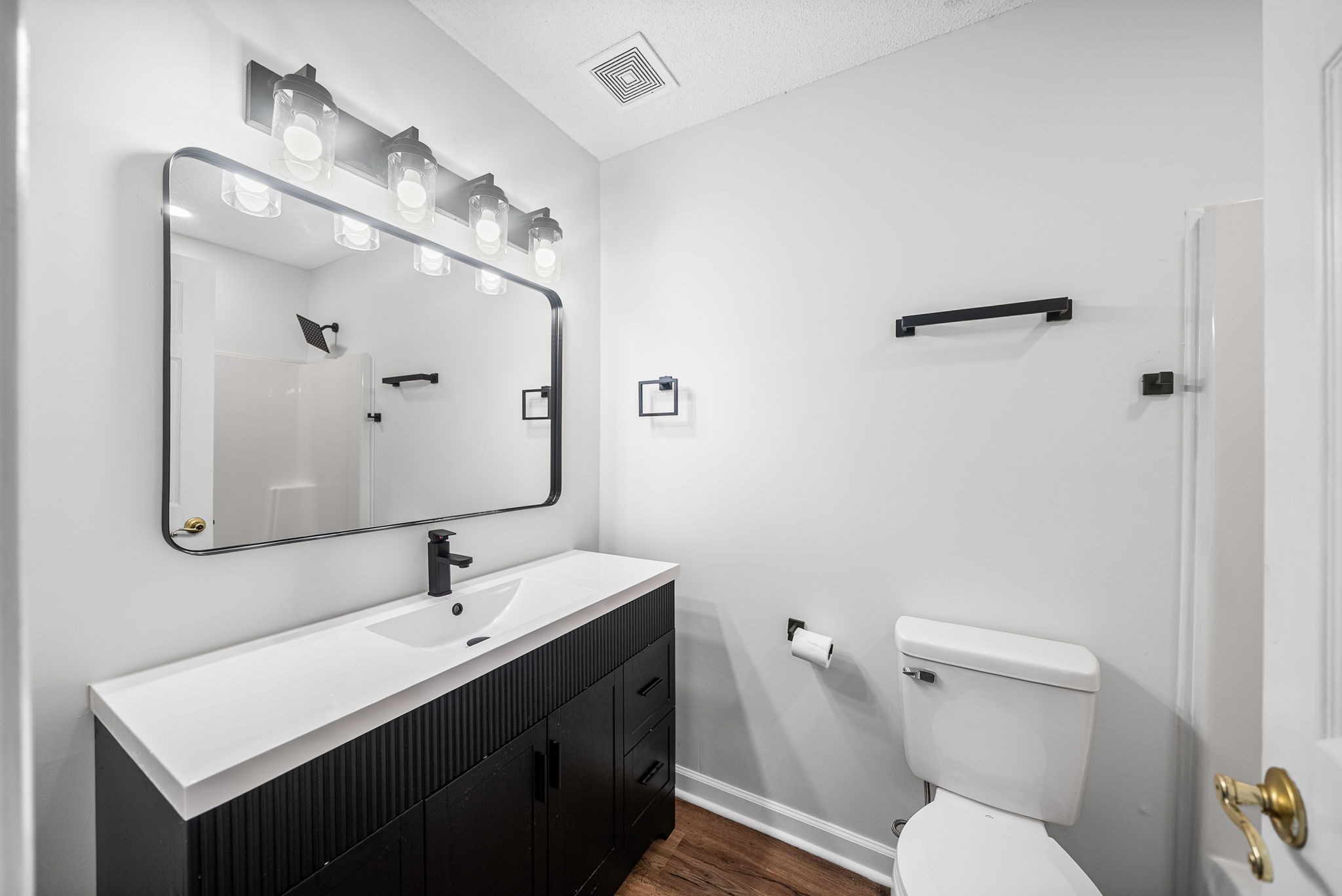1706 Hazelwood Road Clarksville, TN 37042 - Photo 23 of 31 a bathroom with a toilet a sink and mirror
