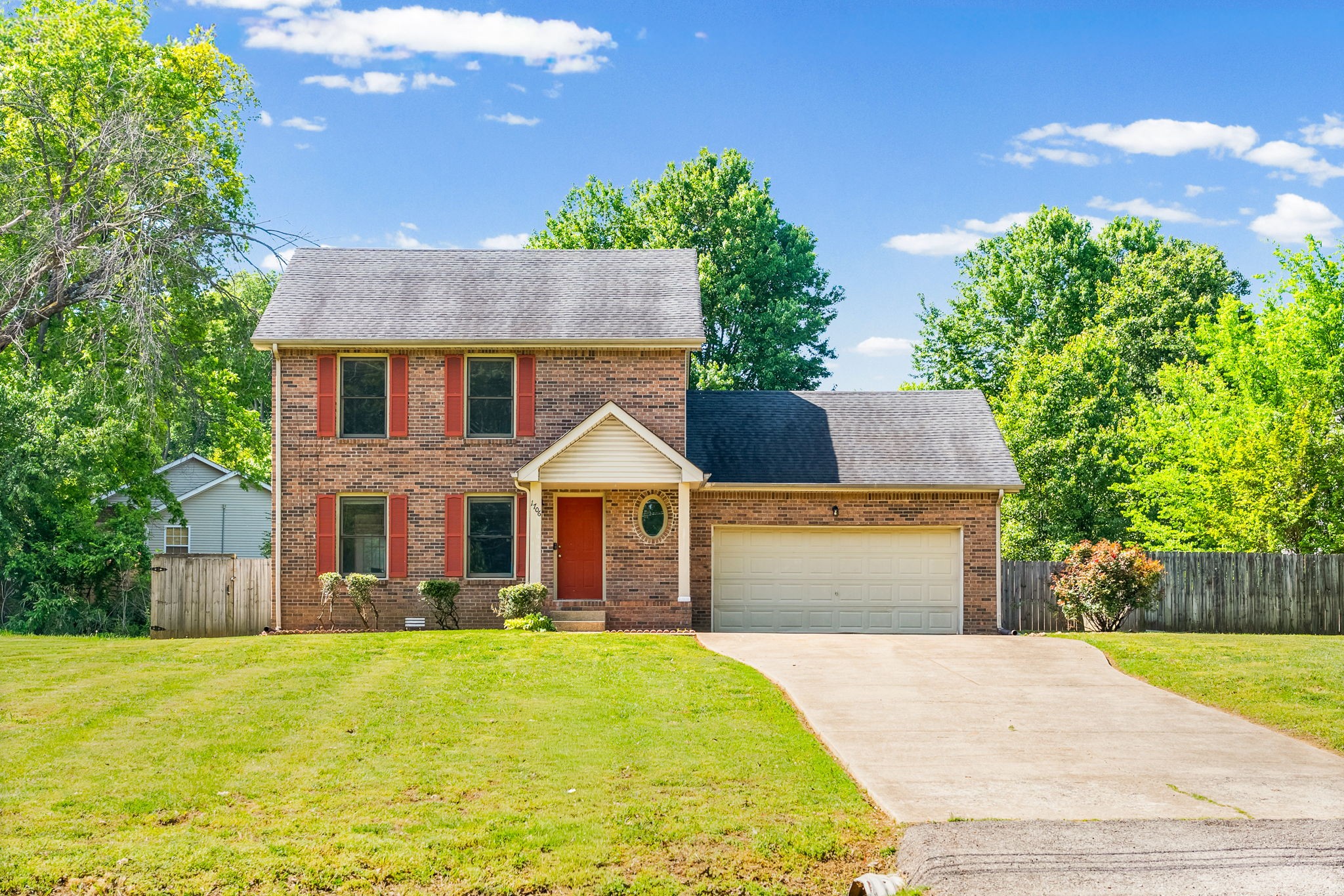 1706 Hazelwood Road Clarksville, TN 37042 - Photo 31 of 31 a front view of a house with a yard and garage