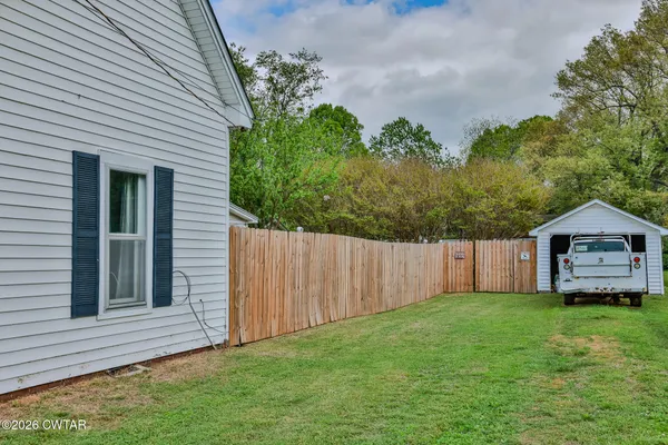 a view of a house with a back yard