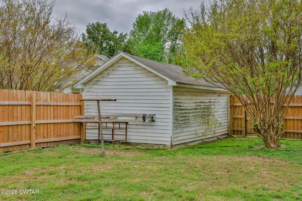 a view of a backyard with a garden