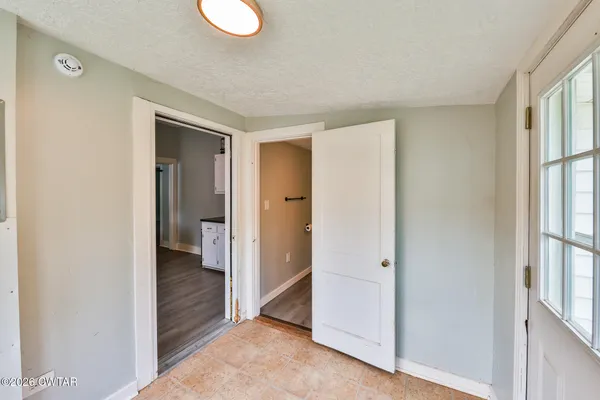 a bathroom with a toilet sink and a mirror