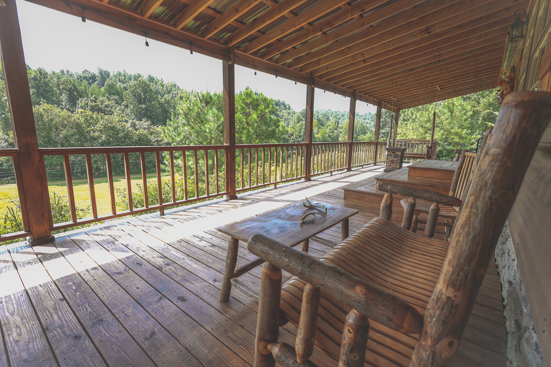555 Lay Hollow Road Waynesboro, TN 38485 - Photo 12 of 68 a view of balcony with furniture and wooden floor