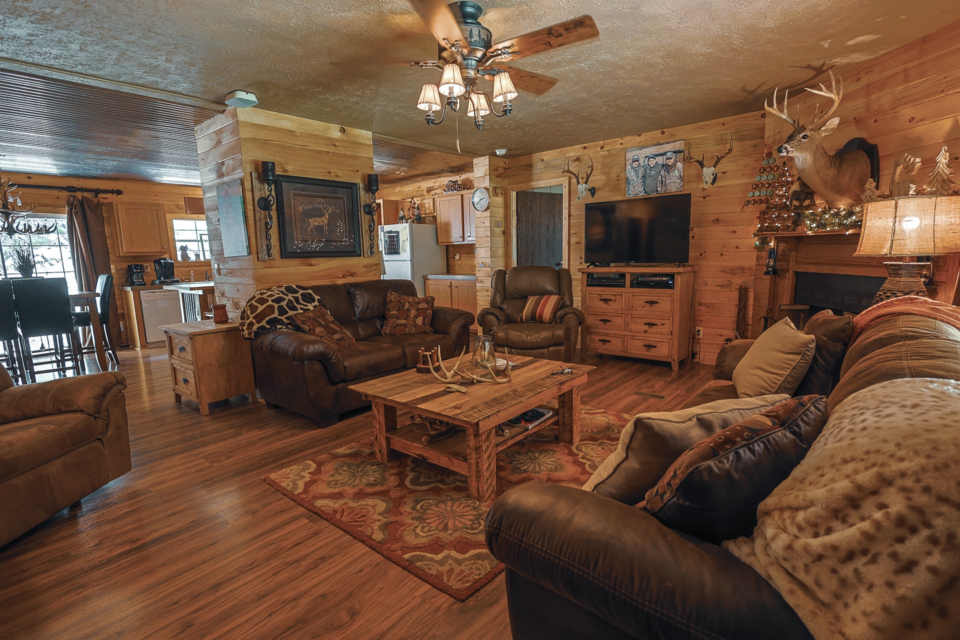 555 Lay Hollow Road Waynesboro, TN 38485 - Photo 14 of 68 a living room with furniture a flat screen tv and kitchen view