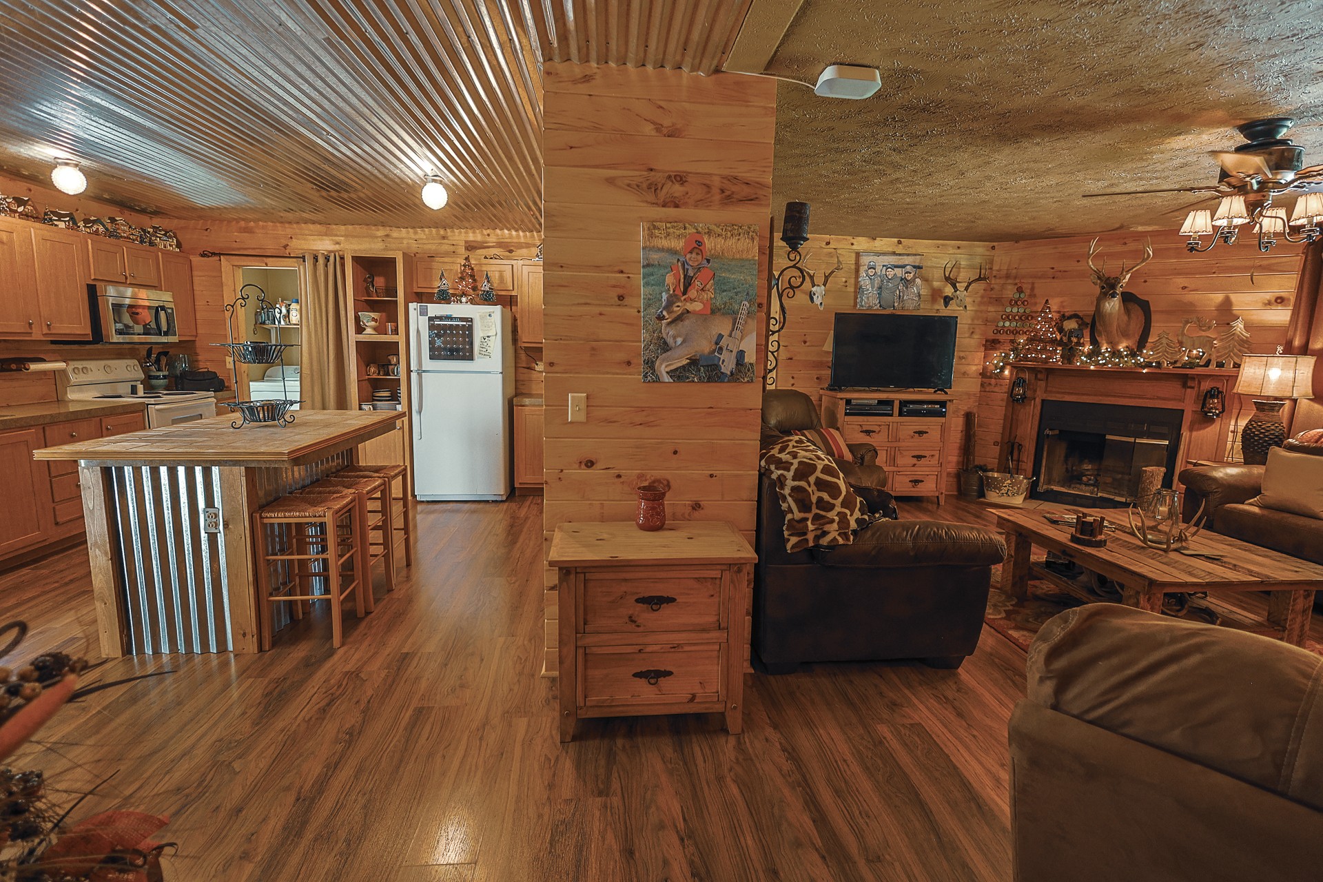 555 Lay Hollow Road Waynesboro, TN 38485 - Photo 16 of 68 a living room with furniture a flat screen tv and a fireplace