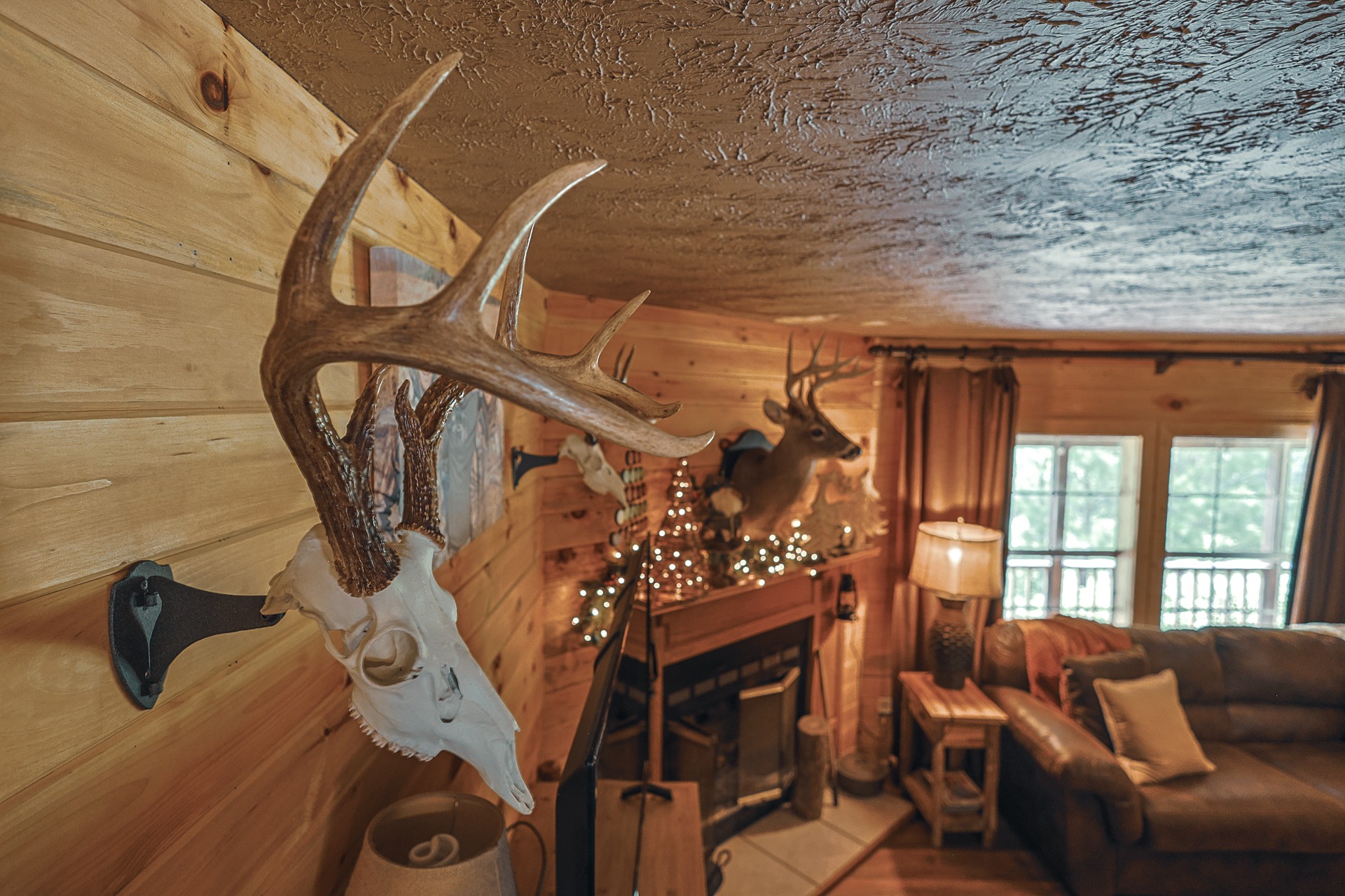 555 Lay Hollow Road Waynesboro, TN 38485 - Photo 20 of 68 a living room with furniture a flat screen tv and a fireplace