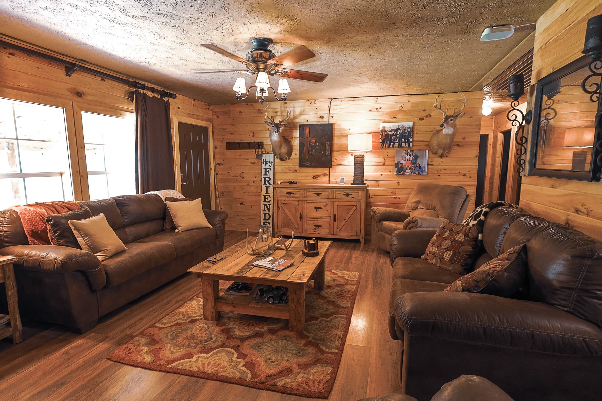 555 Lay Hollow Road Waynesboro, TN 38485 - Photo 21 of 68 a living room with furniture a chandelier and a dining table