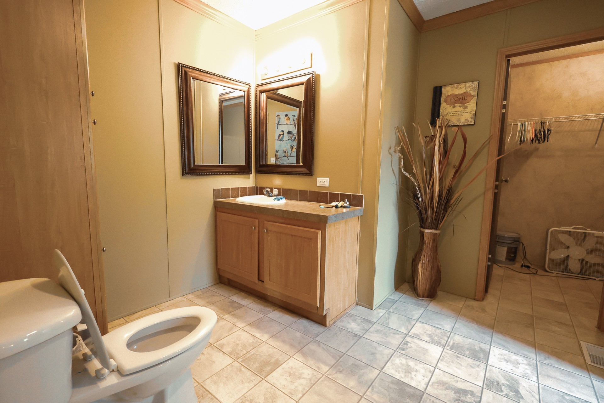 555 Lay Hollow Road Waynesboro, TN 38485 - Photo 24 of 68 a bathroom with a sink a toilet and mirror