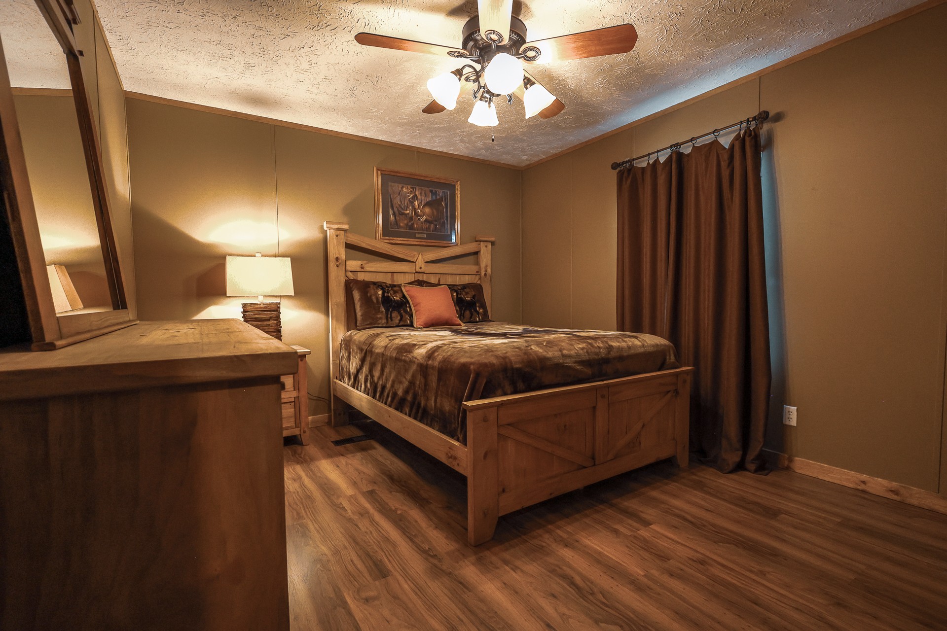 555 Lay Hollow Road Waynesboro, TN 38485 - Photo 27 of 68 a bedroom with a bed and a chandelier