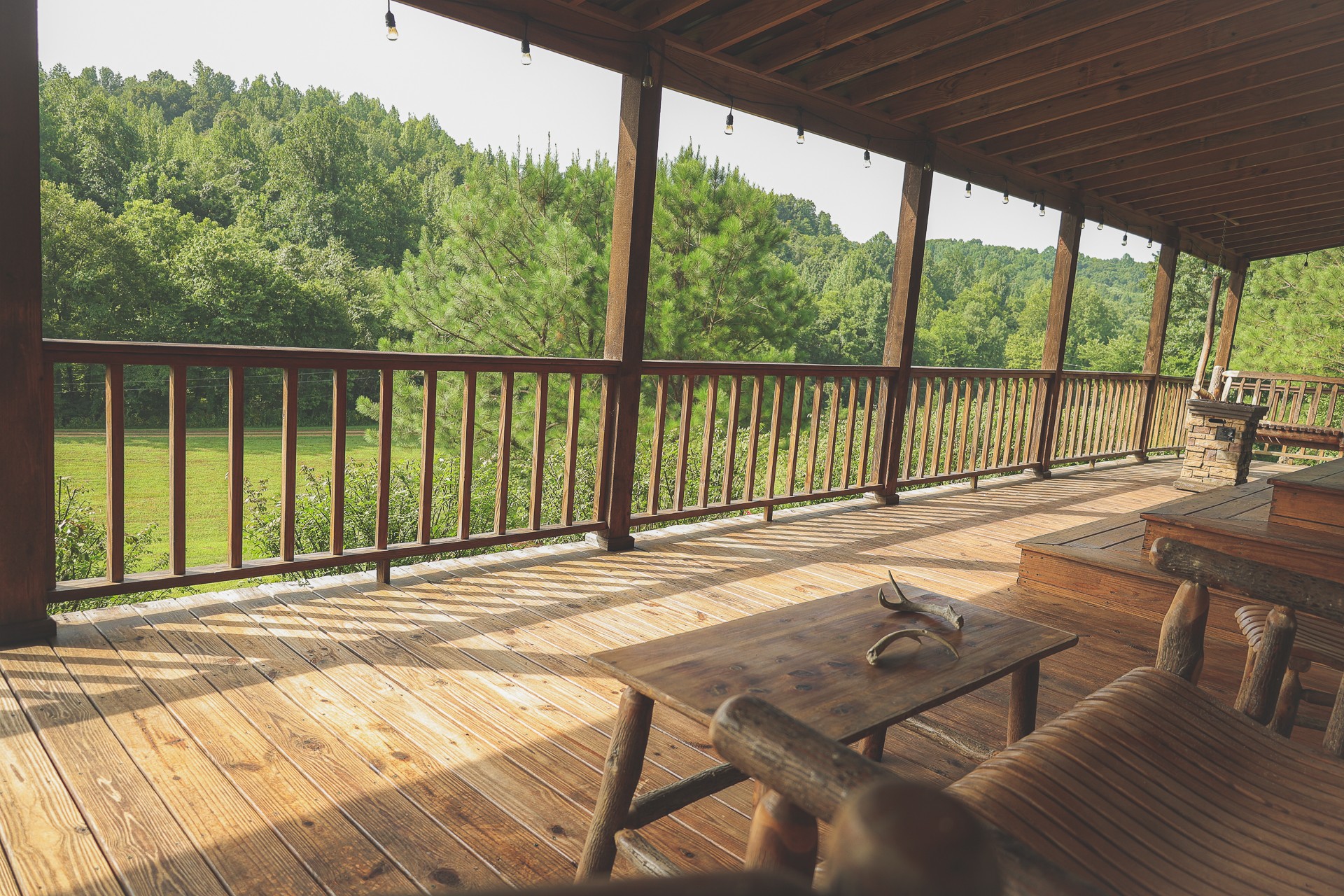 555 Lay Hollow Road Waynesboro, TN 38485 - Photo 8 of 68 a view of a balcony with floor to ceiling windows with wooden floor