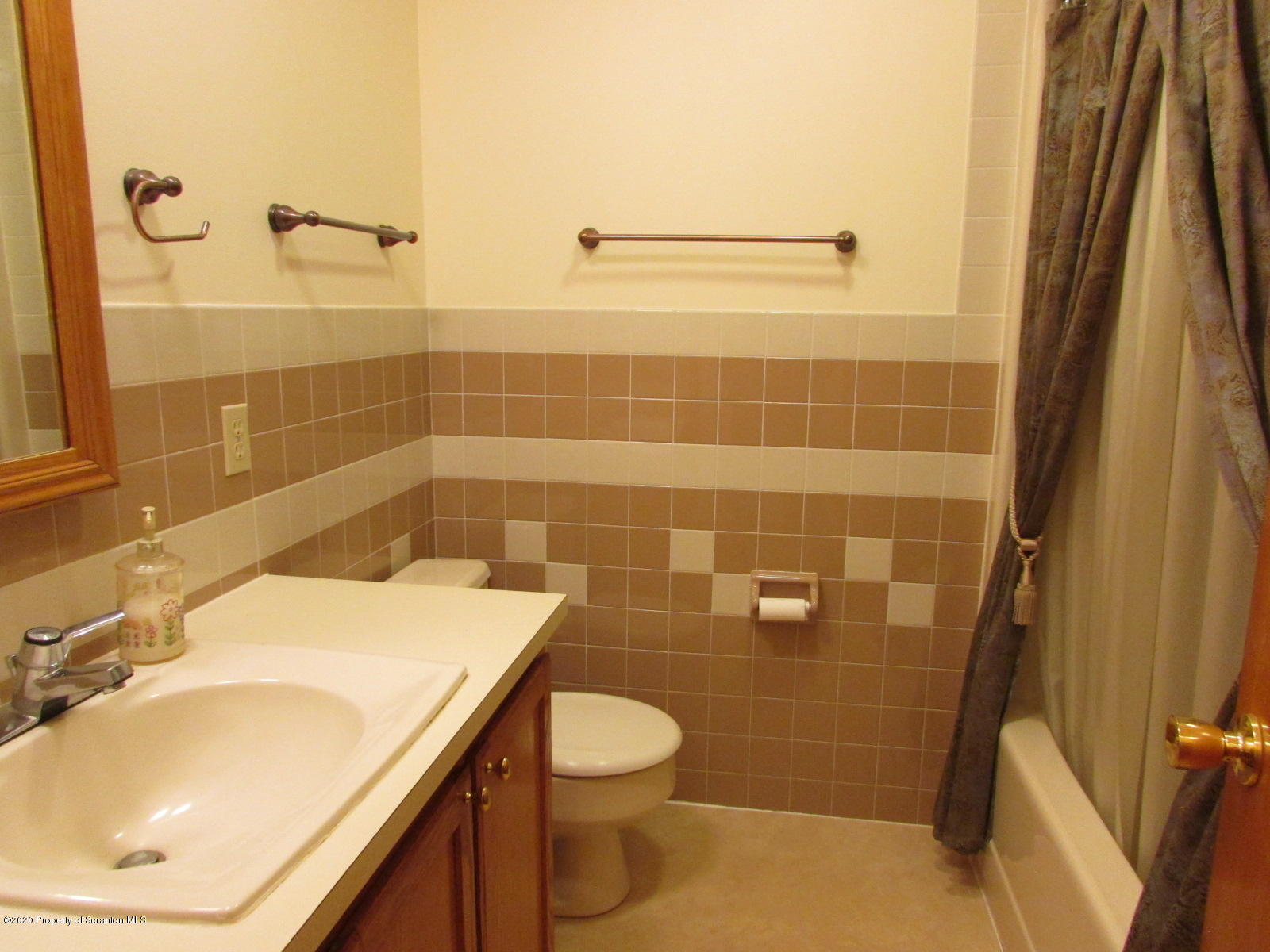 3322 North Road Montrose, PA 18801 - Photo 23 of 38 a bathroom with a sink a toilet and shower