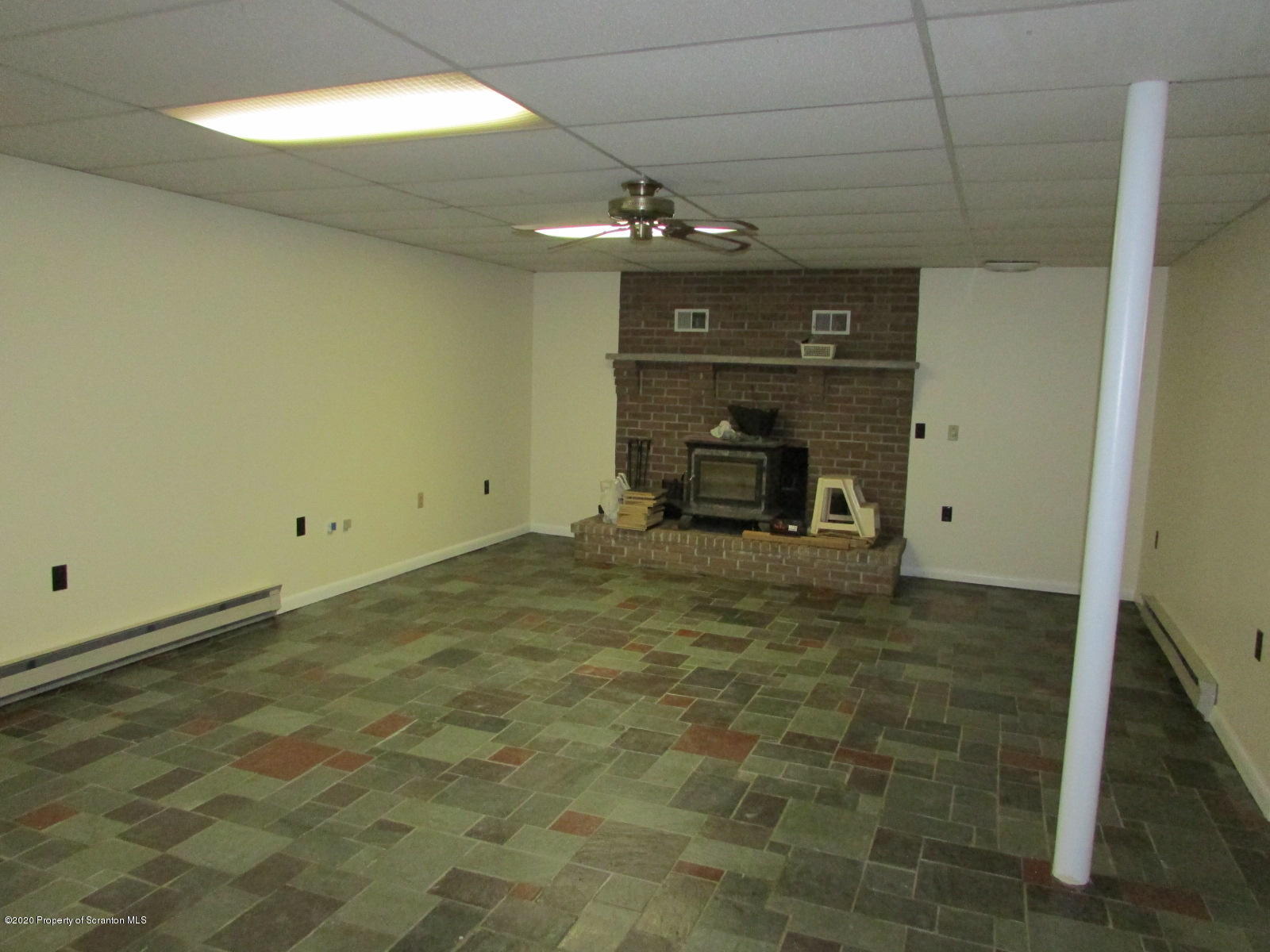 3322 North Road Montrose, PA 18801 - Photo 4 of 38 a view of empty room with a fireplace and chandelier