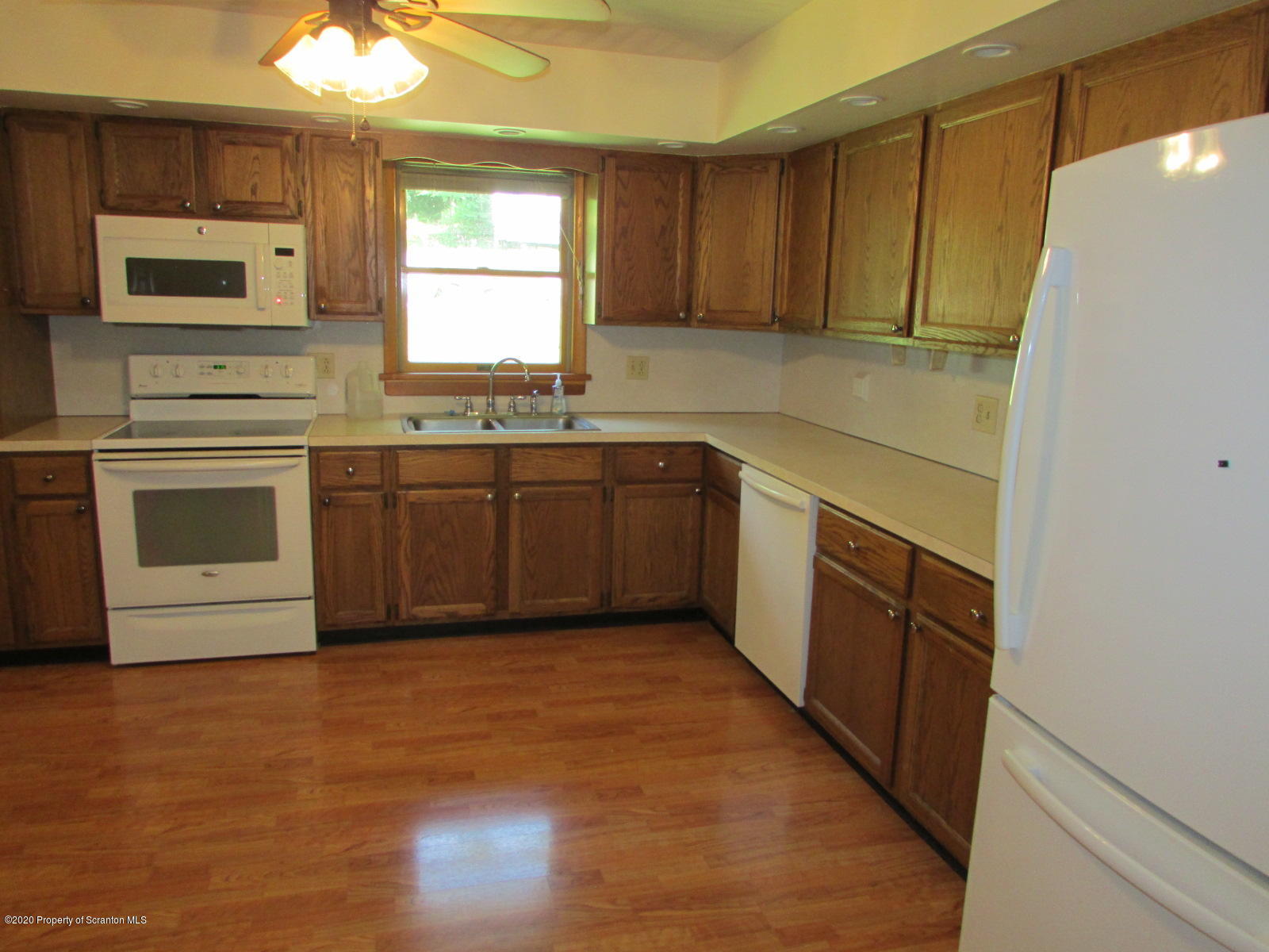 3322 North Road Montrose, PA 18801 - Photo 8 of 38 a kitchen with stainless steel appliances granite countertop a stove a sink and a microwave