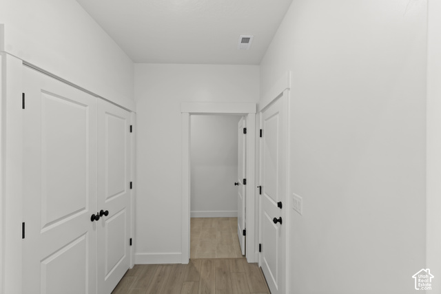 205 East 690th Street North Logan, UT 84321 - Photo 21 of 52 White interior doors with black hardware, wood-finish flooring, and crisp white walls