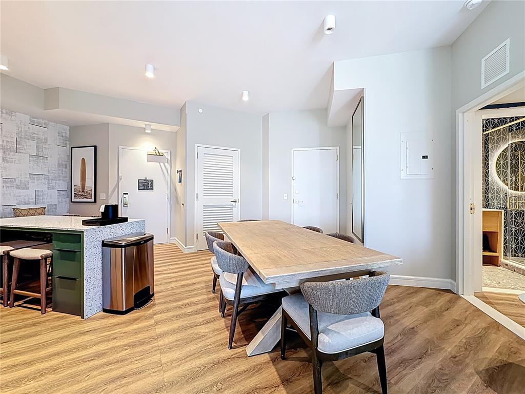 3151 Sunset Walk Drive, Unit 204 Kissimmee, FL 34747 - Photo 17 of 58 a open kitchen with a table and chairs in it