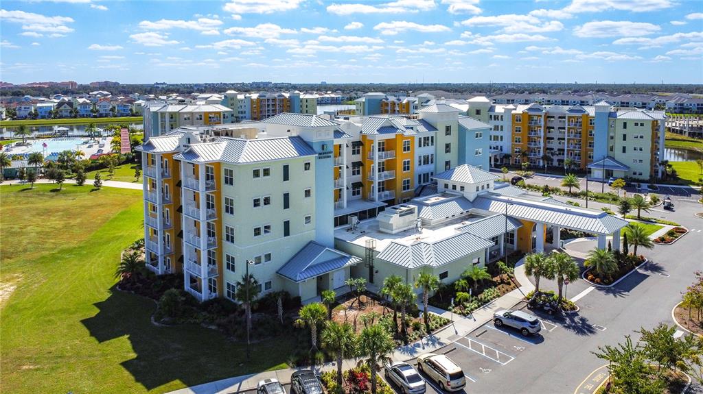 3151 Sunset Walk Drive, Unit 204 Kissimmee, FL 34747 - Photo 2 of 58 a view of a city with tall buildings