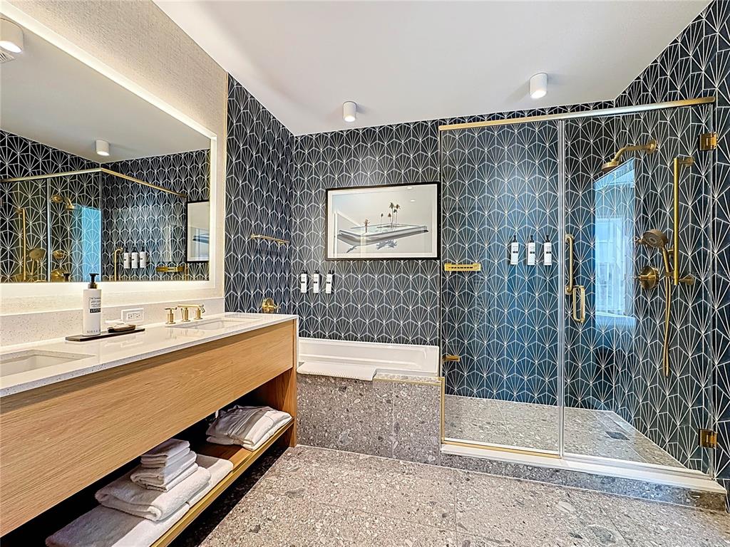 3151 Sunset Walk Drive, Unit 204 Kissimmee, FL 34747 - Photo 26 of 58 a bathroom with a sink and a mirror